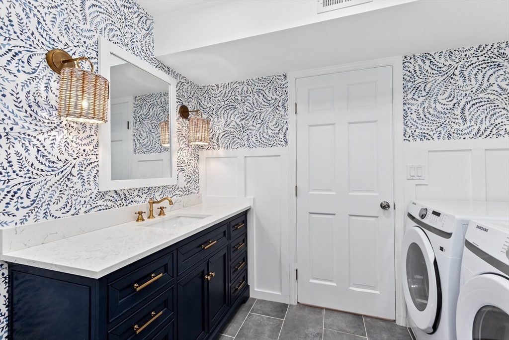 22 Clifford Court Hingham, MA 02043 - Photo 8 of 26 a bathroom with a sink vanity and a mirror