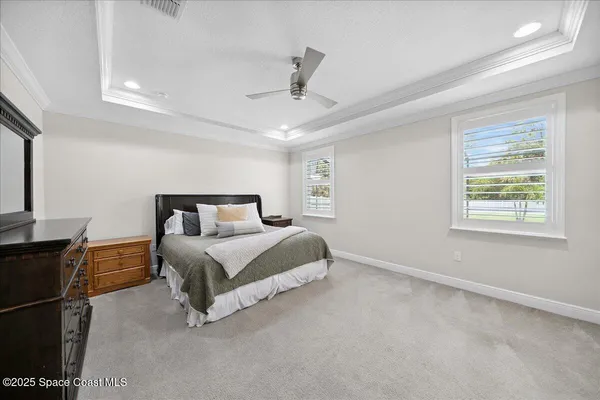 a bedroom with a bed and a tv