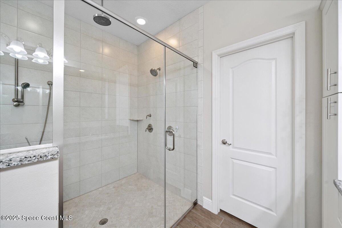 4357 Preservation Circle Melbourne, FL 32934 - Photo 24 of 56 a bathroom with a shower