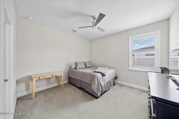 a bathroom with a shower and toilet