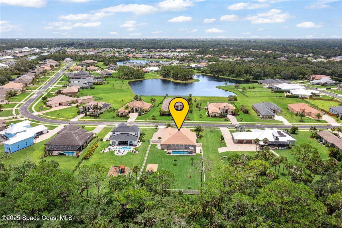 4357 Preservation Circle Melbourne, FL 32934 - Photo 3 of 56 an aerial view of residential houses with outdoor space and lake view