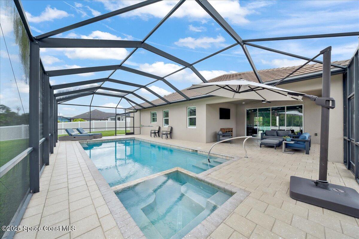 4357 Preservation Circle Melbourne, FL 32934 - Photo 39 of 56 a view of a backyard with sitting area