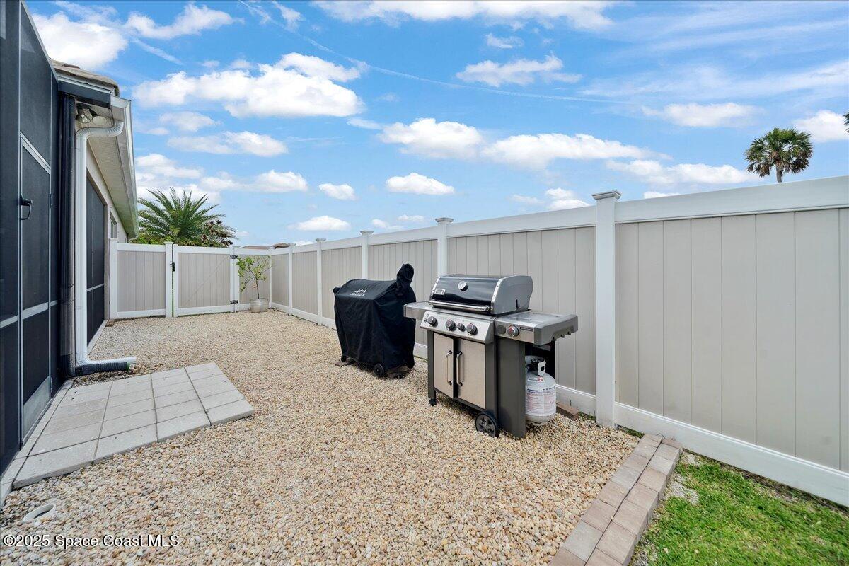 4357 Preservation Circle Melbourne, FL 32934 - Photo 41 of 56 a view of a terrace with furniture and a yard