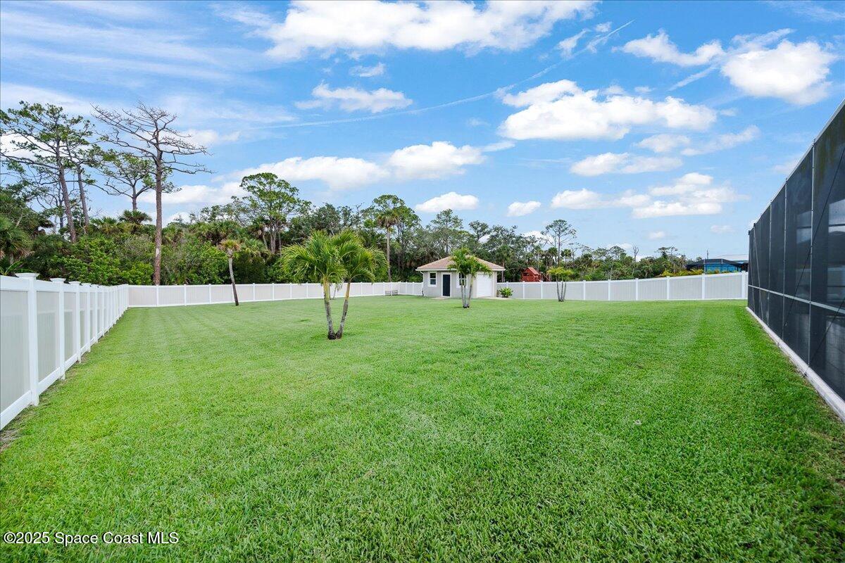 4357 Preservation Circle Melbourne, FL 32934 - Photo 42 of 56 a view of a garden with a slide