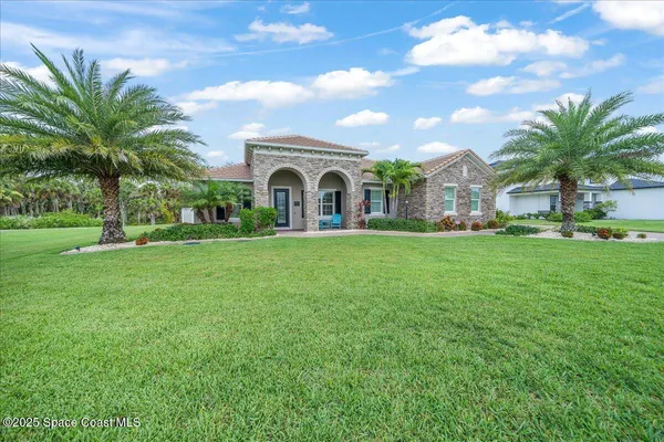 an aerial view of house with yard swimming pool and outdoor seating