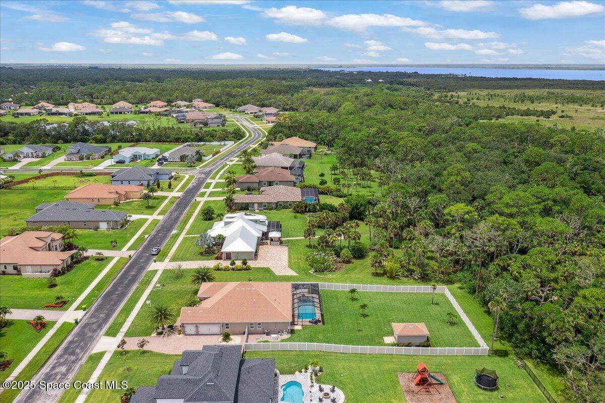4357 Preservation Circle Melbourne, FL 32934 - Photo 49 of 56 an aerial view of house with yard swimming pool and outdoor seating