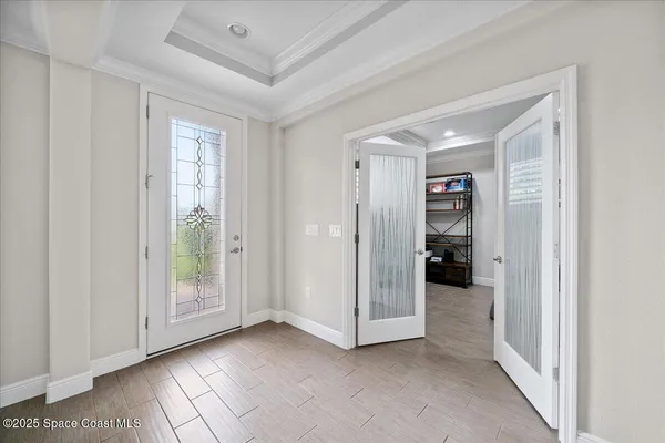 a view of empty room with floor to ceiling window