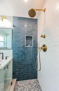 a kitchen with stainless steel appliances a sink and cabinets
