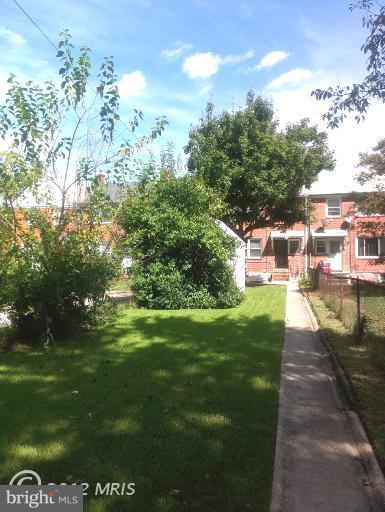 1615 Ramblewood Road Baltimore, MD 21239 - Photo 15 of 19 a view of a back yard of the house