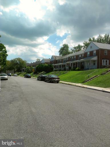 1615 Ramblewood Road Baltimore, MD 21239 - Photo 19 of 19 a view of a house with a big yard and potted plants