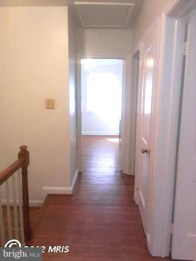 1615 Ramblewood Road Baltimore, MD 21239 - Photo 10 of 19 a view of hallway with stairs and a window