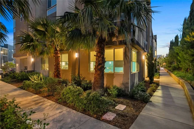 a view of a palm trees in front of house