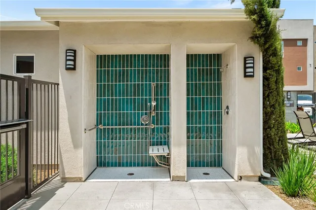 an aerial view of a house with swimming pool and outdoor seating