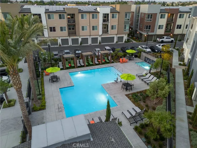 a backyard of a house with a table and chairs