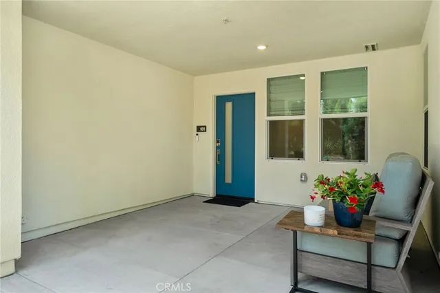 a living room with kitchen island furniture and a large window