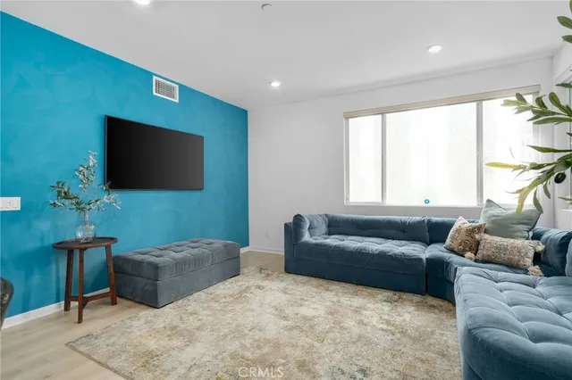 a kitchen with a refrigerator and a sink