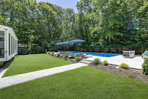 a view of a swimming pool with a patio