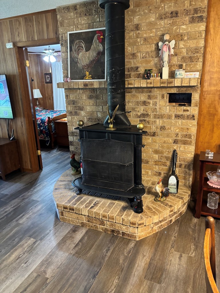 727 Cemetery Road Stonewall, TX 78671 - Photo 4 of 16 a living room with fireplace furniture and a flat screen tv