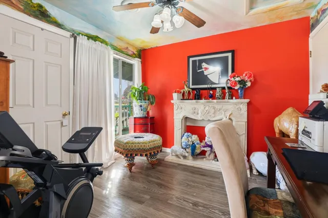 a living room with furniture and a fireplace