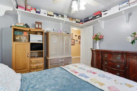 a bedroom with a bed and a dresser