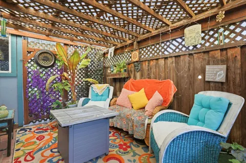 a outdoor living space with furniture and wall paintings
