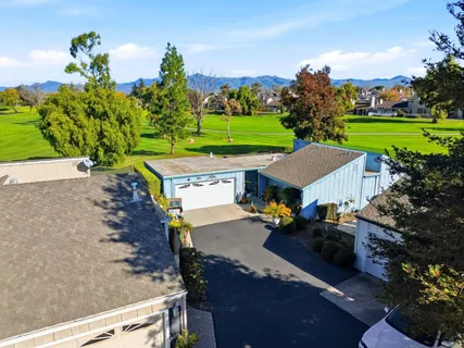 an aerial view of a house with outdoor space