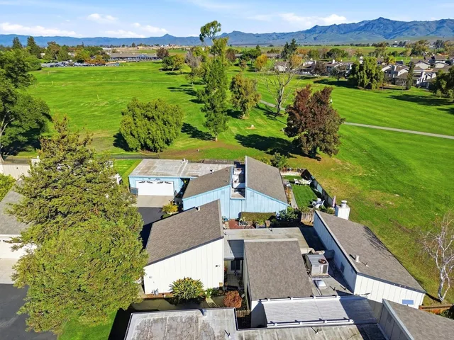 an aerial view of a house with a garden