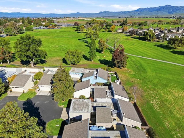 an aerial view of a house with a garden