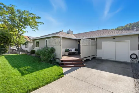 a view of a back yard of the house