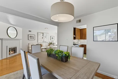 a living room with furniture potted plant and window