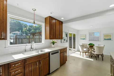 a kitchen with a sink and wooden cabinets