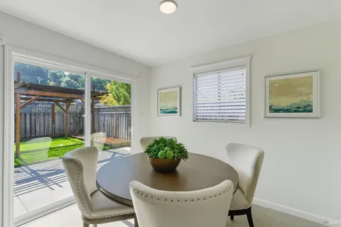 a bedroom with a bed and painting on the wall