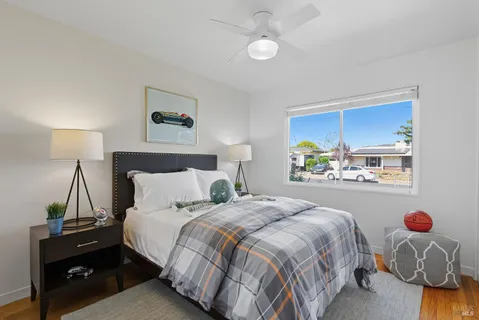 a bedroom with a bed and a window