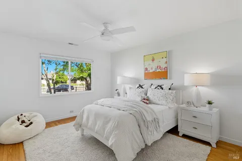 a bedroom with a bed and a lamp