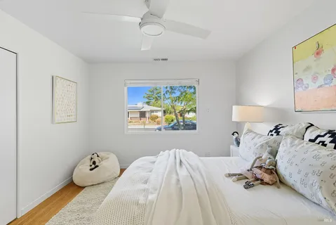 a bedroom with a bed and a window in it