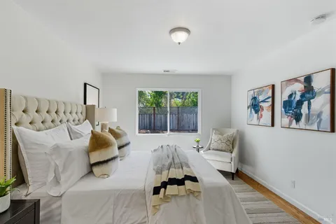 a bedroom with a bed and a couch