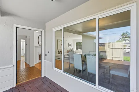 a bathroom with a glass shower door and mirror