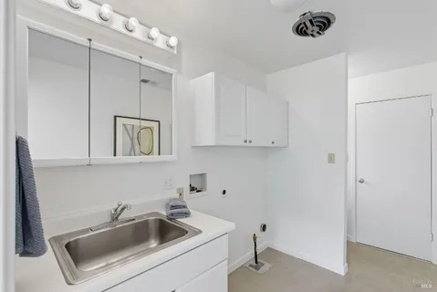 a view of a chairs and table in a backyard