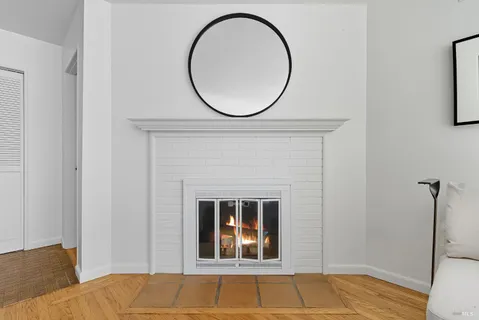 a view of a livingroom with furniture and a fireplace