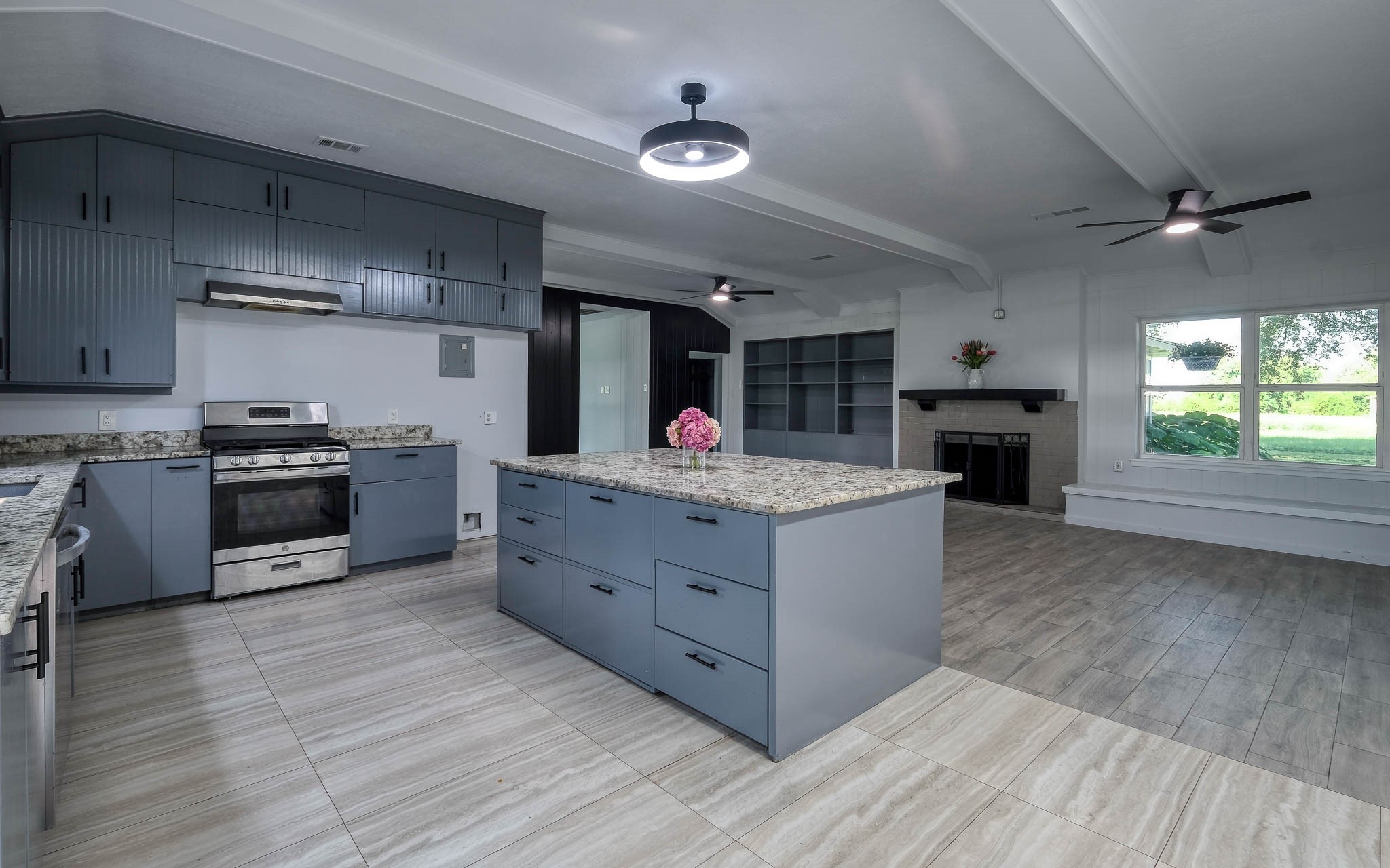 20515 Kickapoo Road Waller, TX 77484 - Photo 2 of 50 a kitchen with stainless steel appliances granite countertop a stove and a refrigerator