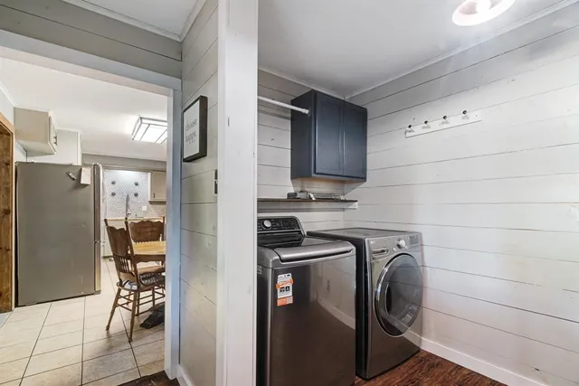 a kitchen with stainless steel appliances a refrigerator and a stove