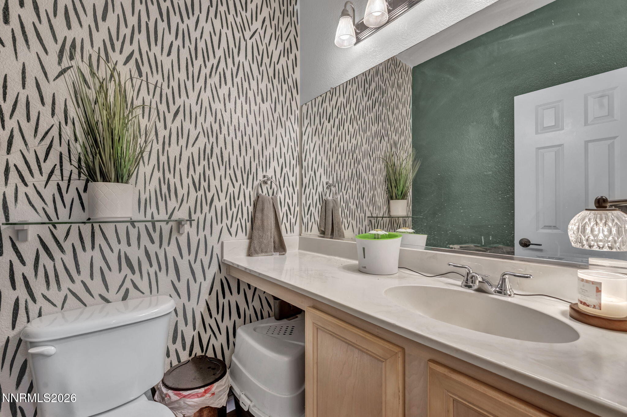4592 Kathleen Denise Lane Reno, NV 89503 - Photo 9 of 22 a bathroom with a granite countertop sink and a toilet