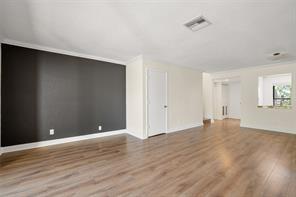 1700 Northwest 4th Avenue Boca Raton, FL 33432 - Photo 9 of 14 an empty room with wooden floor and windows