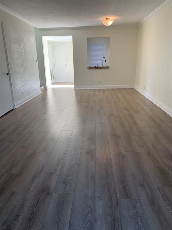 1700 Northwest 4th Avenue Boca Raton, FL 33432 - Photo 10 of 14 an empty room with wooden floor and windows