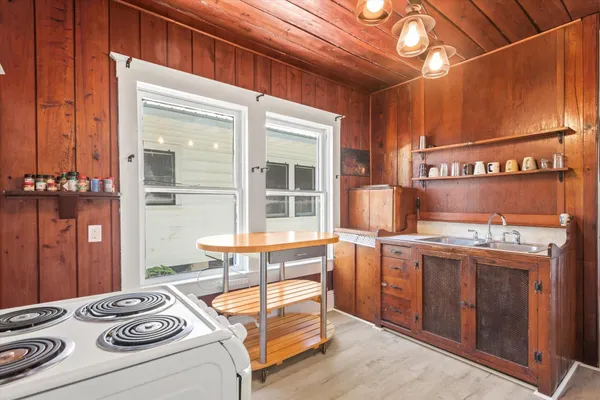 a kitchen that has a lot of cabinets in it