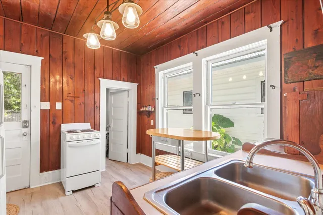 a kitchen with a refrigerator and a sink
