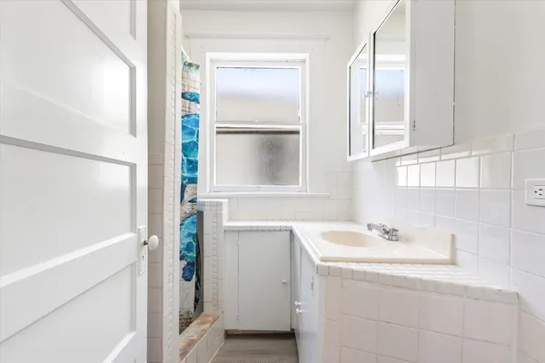 a bathroom with a sink and a mirror