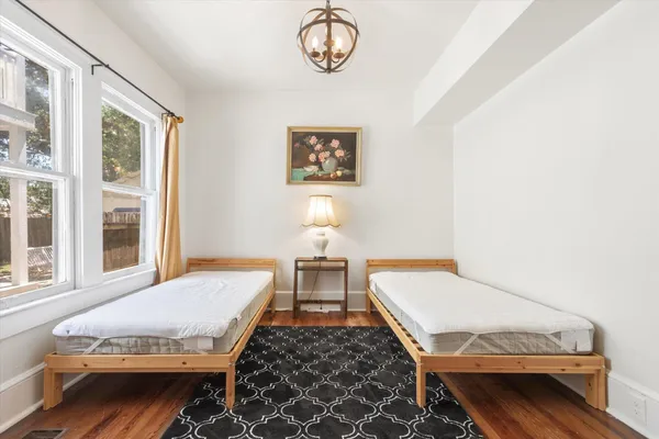 a bedroom with a bed and window