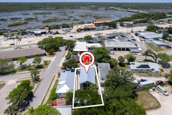 an aerial view of residential building and parking space