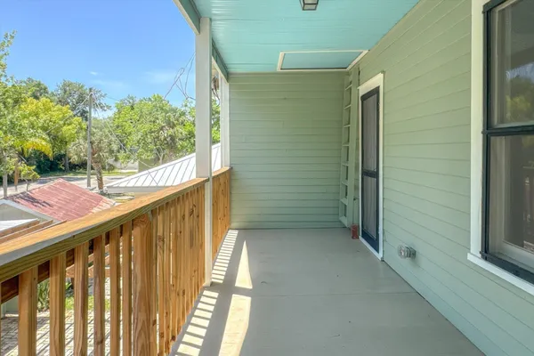 a view of a balcony with an outdoor space